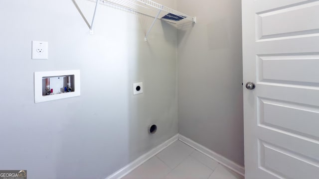 3368 Alhambra Cir, Hampton, GA 30228 - washroom with hookup for an electric dryer, washer hookup, and light tile patterned flooring