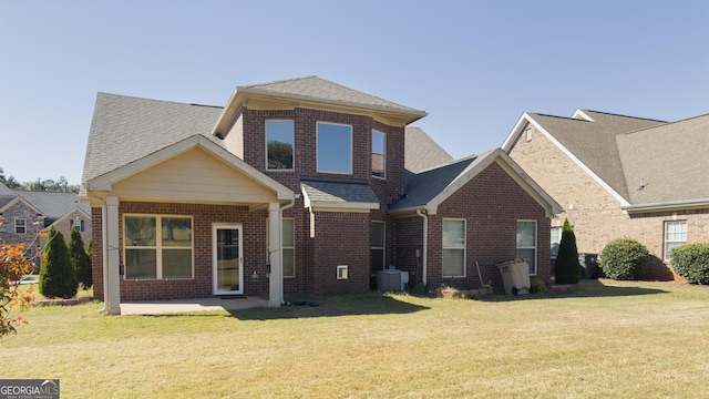 3368 Alhambra Cir, Hampton, GA 30228 - rear view of property featuring brick siding, a lawn, and a shingled roof