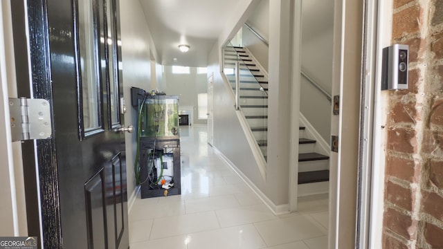 3368 Alhambra Cir, Hampton, GA 30228 - hallway featuring stairway and tile patterned flooring