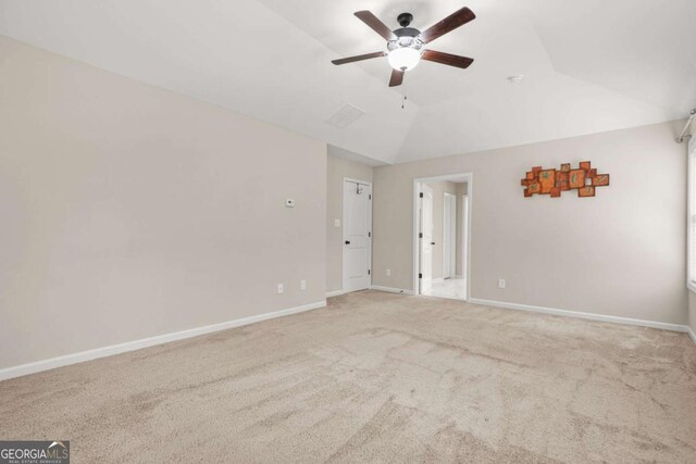 255 Hamilton Dr, Newnan, GA 30263 - empty room with a ceiling fan, carpet floors, and lofted ceiling
