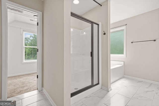 255 Hamilton Dr, Newnan, GA 30263 - full bath with a shower stall, a garden tub, and marble look tiles