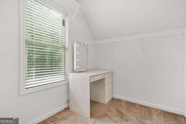 255 Hamilton Dr, Newnan, GA 30263 - walk in closet with vaulted ceiling and light colored carpet