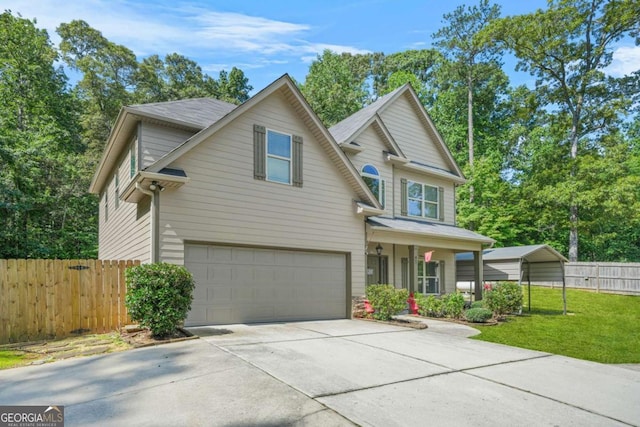 255 Hamilton Dr, Newnan, GA 30263 - traditional-style house featuring driveway, an attached garage, and covered porch