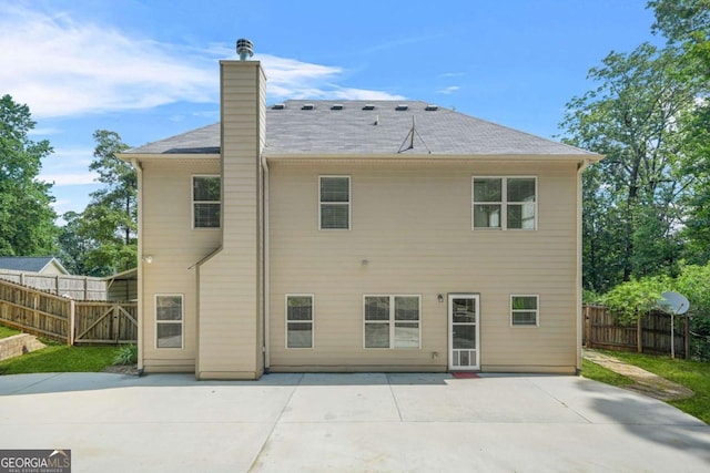 255 Hamilton Dr, Newnan, GA 30263 - back of house with a patio and a chimney