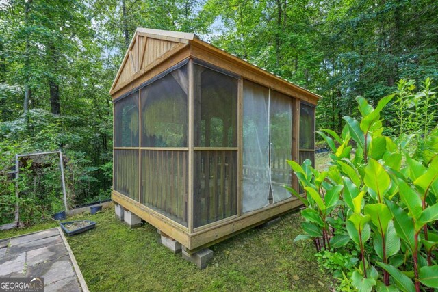 255 Hamilton Dr, Newnan, GA 30263 - view of outdoor structure featuring a sunroom