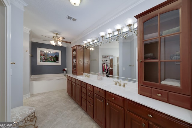 1000 Collingtree Ct, Mcdonough, GA 30253 - bathroom featuring a ceiling fan, ornamental molding, double vanity, a bath, and a spacious closet