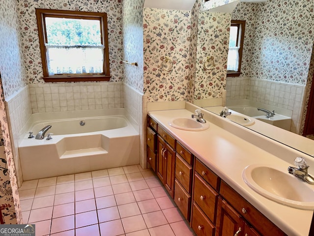 4494 Anderson Hwy, Hartwell, GA 30643 - bathroom featuring wallpapered walls, a garden tub, healthy amount of natural light, wainscoting, and tile patterned floors