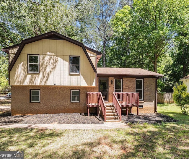 240 Wellington Dr, Mcdonough, GA 30252 - split level home with brick siding and a deck