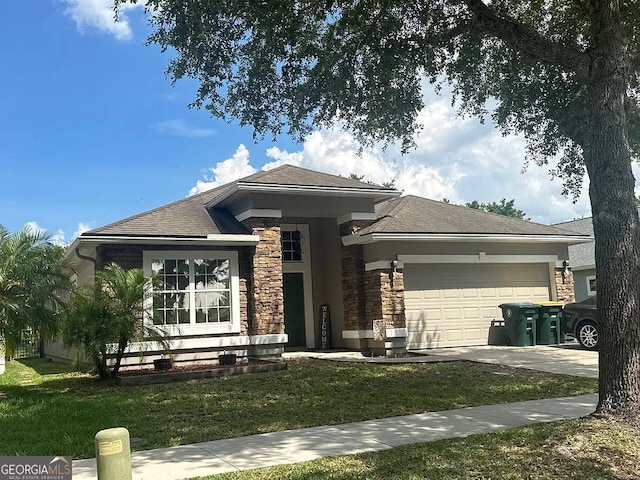 5785 Alamosa Cir, Jacksonville, FL 32258 - view of front facade featuring stone siding, a garage, a front lawn, and driveway