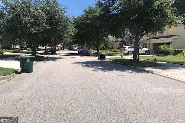 5785 Alamosa Cir, Jacksonville, FL 32258 - view of asphalt road with curbs and sidewalks