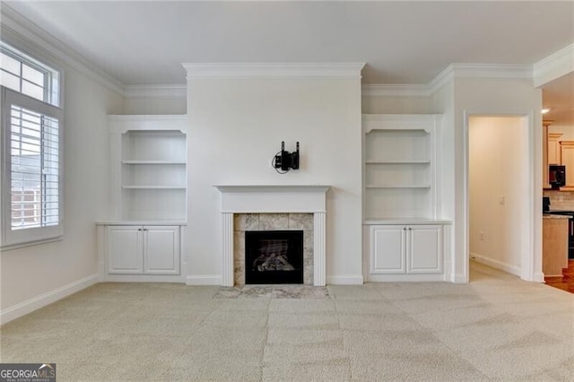 3411 Lindenridge Dr, Buford, GA 30519 - unfurnished living room featuring ornamental molding, a tiled fireplace, and carpet flooring