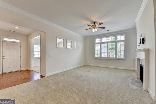 3411 Lindenridge Dr, Buford, GA 30519 - unfurnished living room featuring light carpet, ceiling fan, ornamental molding, and a fireplace with flush hearth