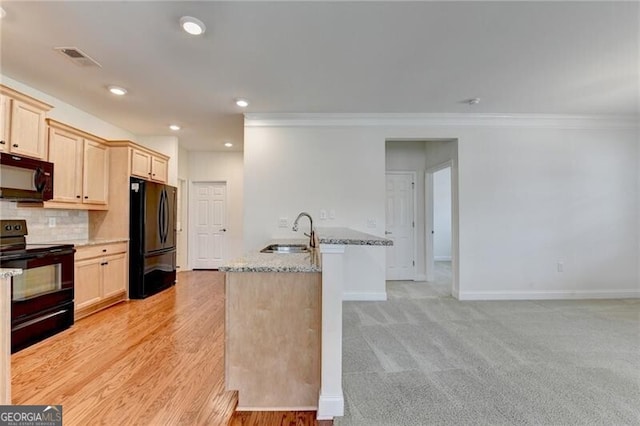 3411 Lindenridge Dr, Buford, GA 30519 - kitchen featuring black appliances, crown molding, light stone countertops, backsplash, and recessed lighting