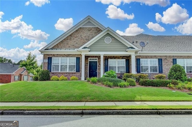 3411 Lindenridge Dr, Buford, GA 30519 - craftsman-style house featuring a front lawn and brick siding