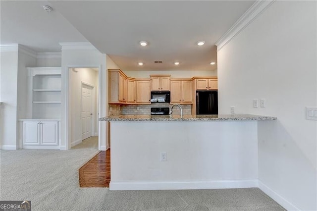 3411 Lindenridge Dr, Buford, GA 30519 - kitchen featuring black appliances, crown molding, carpet, light stone countertops, and tasteful backsplash