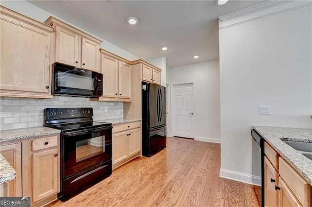 3411 Lindenridge Dr, Buford, GA 30519 - kitchen featuring black appliances, light brown cabinetry, light wood-style floors, and recessed lighting