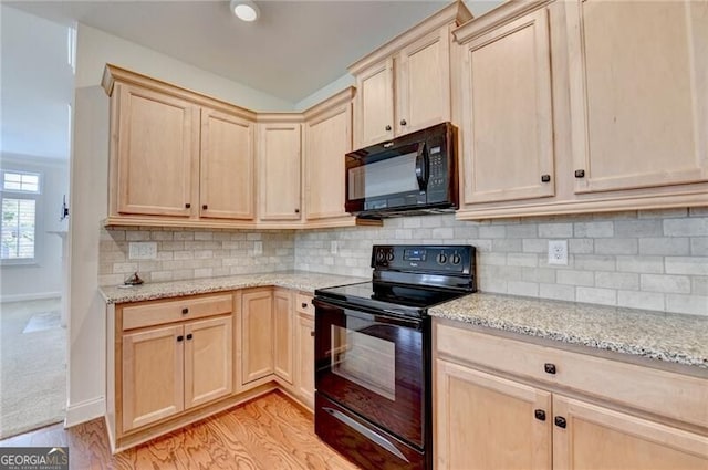 3411 Lindenridge Dr, Buford, GA 30519 - kitchen featuring black appliances, light brown cabinets, and light stone countertops