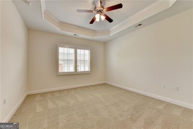 3411 Lindenridge Dr, Buford, GA 30519 - unfurnished room featuring a raised ceiling, light carpet, a smoke detector, crown molding, and a ceiling fan