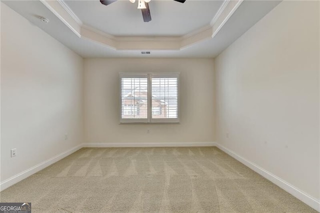 3411 Lindenridge Dr, Buford, GA 30519 - spare room featuring a tray ceiling, ornamental molding, carpet floors, ceiling fan, and a smoke detector