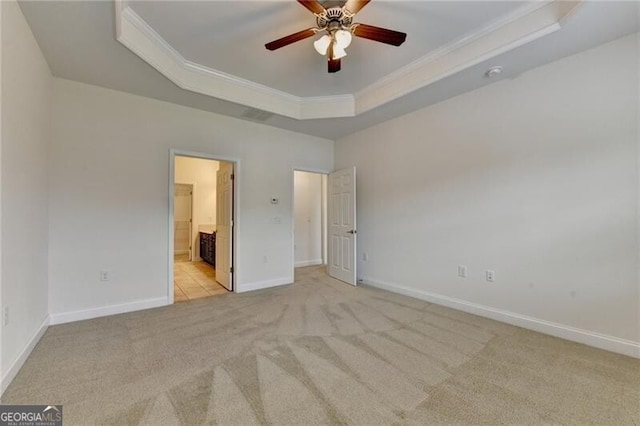 3411 Lindenridge Dr, Buford, GA 30519 - unfurnished bedroom with a raised ceiling, light colored carpet, ornamental molding, and ensuite bath