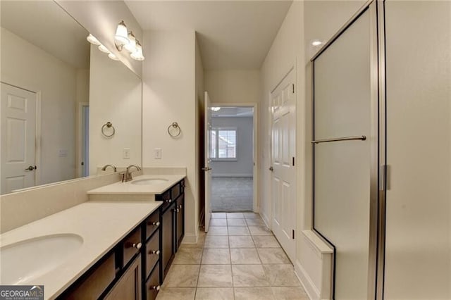 3411 Lindenridge Dr, Buford, GA 30519 - full bathroom featuring double vanity, tile patterned flooring, and an enclosed shower