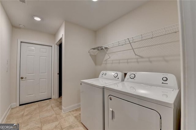 3411 Lindenridge Dr, Buford, GA 30519 - laundry area featuring baseboards and washing machine and clothes dryer