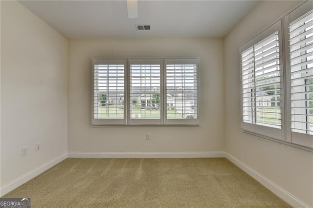 3411 Lindenridge Dr, Buford, GA 30519 - unfurnished room with plenty of natural light, light colored carpet, and a ceiling fan