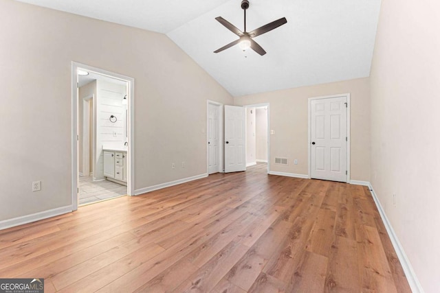 4210 Platinum Ct, Hoschton, GA 30548 - unfurnished bedroom featuring light wood-type flooring, vaulted ceiling, and ensuite bathroom