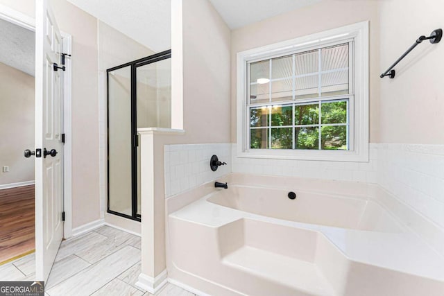 4210 Platinum Ct, Hoschton, GA 30548 - bathroom with a bath and a shower stall