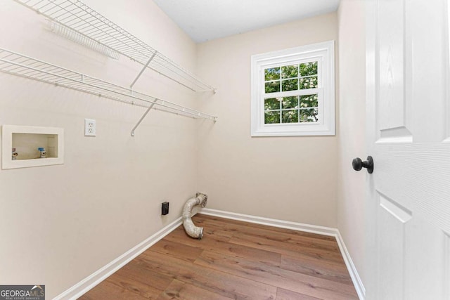 4210 Platinum Ct, Hoschton, GA 30548 - laundry room featuring hookup for a washing machine, wood finished floors, and hookup for an electric dryer