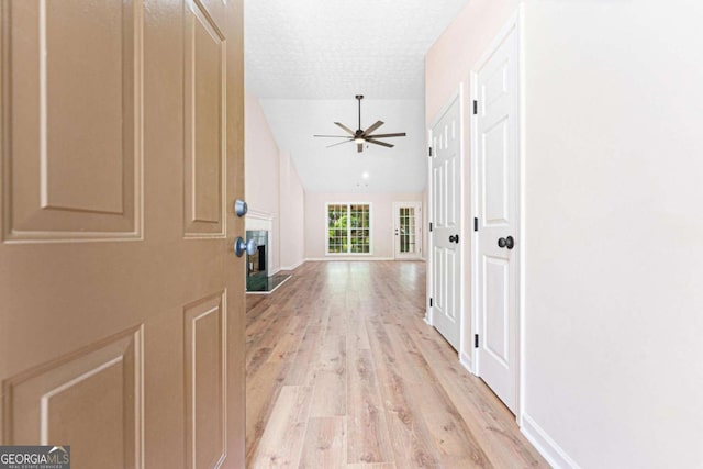 4210 Platinum Ct, Hoschton, GA 30548 - hallway featuring light wood-type flooring and a textured ceiling