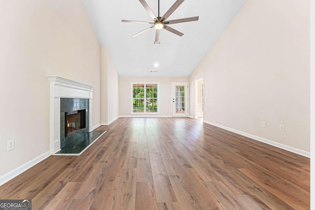 4210 Platinum Ct, Hoschton, GA 30548 - unfurnished living room with high vaulted ceiling, a high end fireplace, wood finished floors, and a ceiling fan