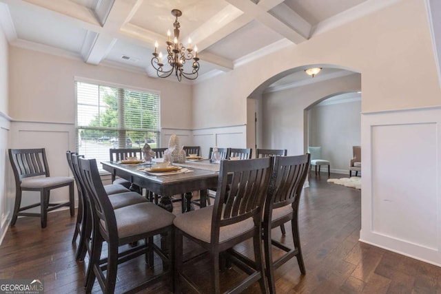 2307 Loughridge Dr, Buford, GA 30519 - dining space featuring coffered ceiling, a chandelier, arched walkways, a decorative wall, and beamed ceiling
