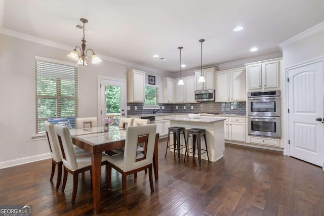 2307 Loughridge Dr, Buford, GA 30519 - dining room featuring crown molding, a chandelier, dark wood-style flooring, and recessed lighting
