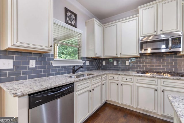 2307 Loughridge Dr, Buford, GA 30519 - kitchen featuring appliances with stainless steel finishes, dark wood-type flooring, light stone counters, and decorative backsplash