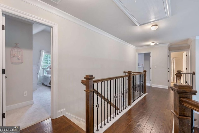 2307 Loughridge Dr, Buford, GA 30519 - hallway with an upstairs landing, attic access, wood-type flooring, and crown molding