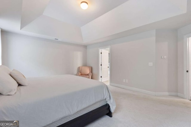 2307 Loughridge Dr, Buford, GA 30519 - carpeted bedroom featuring a raised ceiling and baseboards