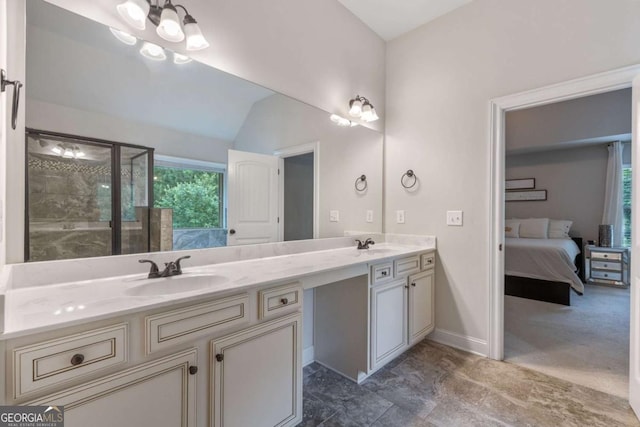 2307 Loughridge Dr, Buford, GA 30519 - ensuite bathroom featuring double vanity, a shower stall, and lofted ceiling