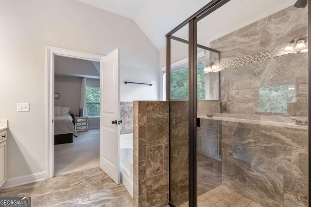 2307 Loughridge Dr, Buford, GA 30519 - full bathroom with vanity, vaulted ceiling, a garden tub, connected bathroom, and a stall shower