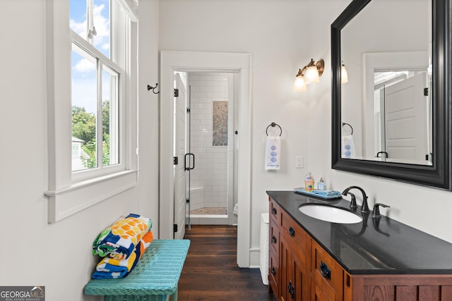 31 Frederica Oaks Ln, Saint Simons, GA 31522 - full bath featuring vanity, a stall shower, and wood finished floors