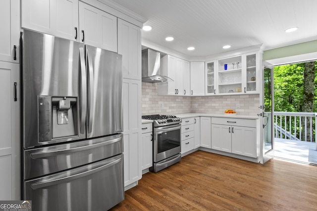 970 Pine Grove Pointe Dr, Roswell, GA 30075 - kitchen with appliances with stainless steel finishes, wall chimney range hood, light countertops, glass insert cabinets, and decorative backsplash