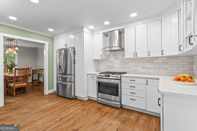 970 Pine Grove Pointe Dr, Roswell, GA 30075 - kitchen with stainless steel appliances, wall chimney range hood, crown molding, light countertops, and recessed lighting