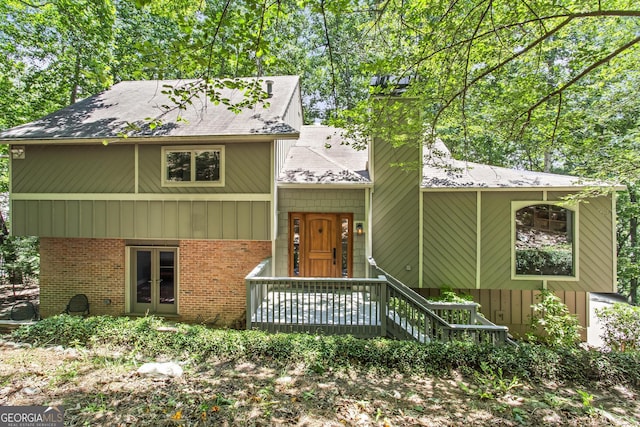 970 Pine Grove Pointe Dr, Roswell, GA 30075 - view of front of home with brick siding, a shingled roof, french doors, and a chimney