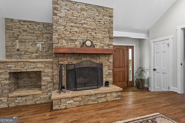 970 Pine Grove Pointe Dr, Roswell, GA 30075 - unfurnished living room with vaulted ceiling, wood finished floors, and a fireplace