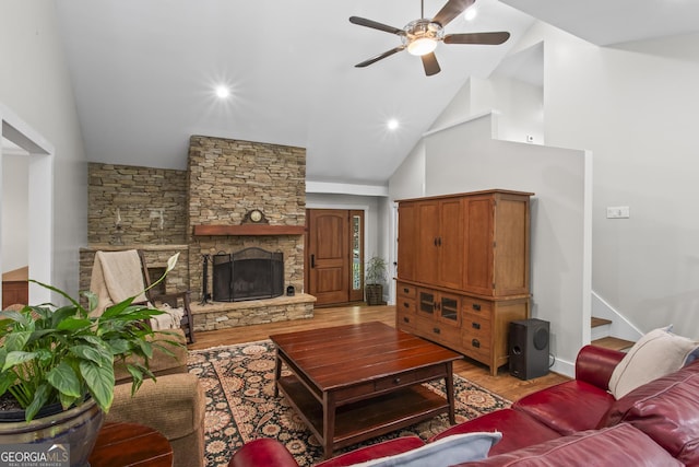 970 Pine Grove Pointe Dr, Roswell, GA 30075 - living room featuring ceiling fan, light wood-style flooring, high vaulted ceiling, a fireplace, and stairs