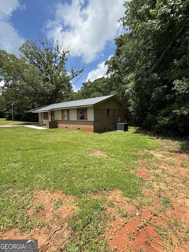 307 Hickman Rd, Forsyth, GA 31029 - ranch-style house featuring crawl space, a front lawn, and brick siding