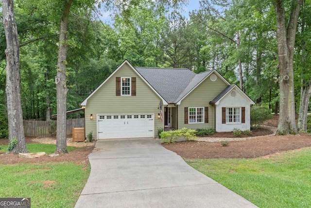 15 Stonewood Way, Sharpsburg, GA 30277 - traditional home with concrete driveway, view of scattered trees, a shingled roof, and a garage