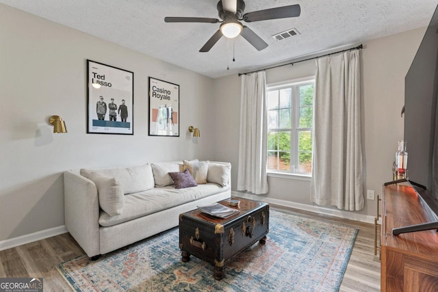 15 Stonewood Way, Sharpsburg, GA 30277 - living area with a textured ceiling, wood finished floors, and a ceiling fan