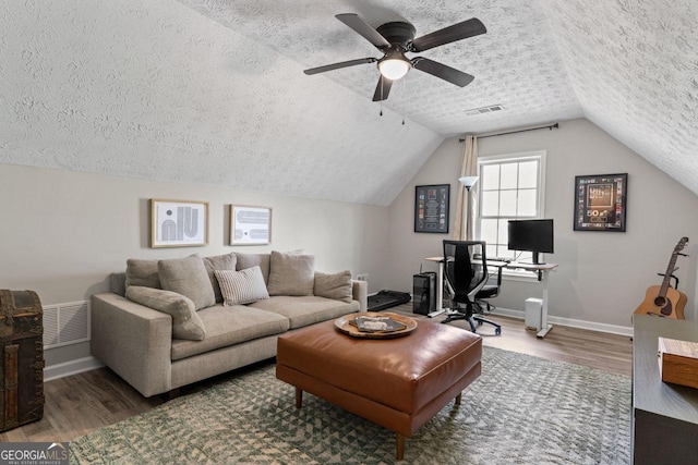 15 Stonewood Way, Sharpsburg, GA 30277 - living area with a textured ceiling, wood finished floors, a ceiling fan, vaulted ceiling, and an office area