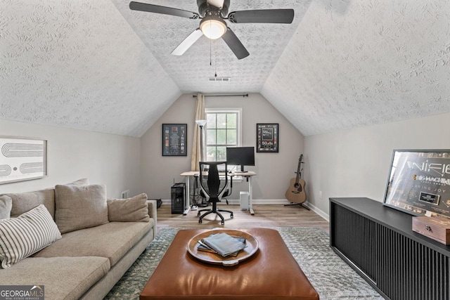 15 Stonewood Way, Sharpsburg, GA 30277 - office featuring a textured ceiling, wood finished floors, vaulted ceiling, and ceiling fan